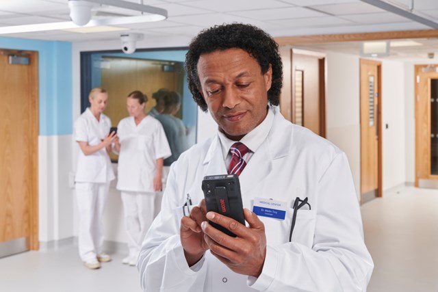 male doctor texting on Myco 4  phone
